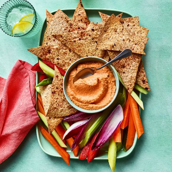 Nachos with a red pepper dip