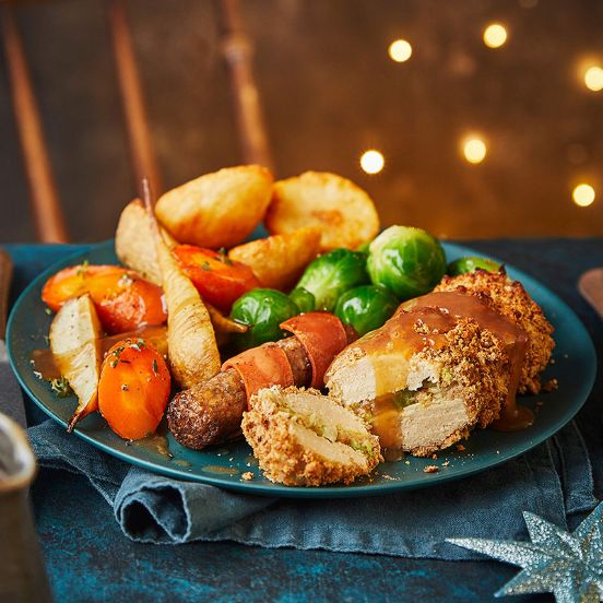 Cheesy leek-stuffed Quorn with maple ‘pigs in blankets’